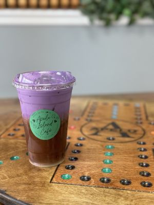 White chocolate macadamia nut iced latte with ube cold foam