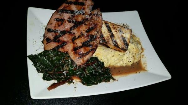 Grilled Pork Steak with pecorino grits and garlic swiss chard