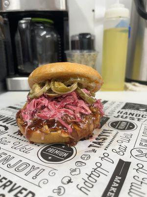 Sweet Chili BBQ Pulled Pork topped with red cabbage slaw & pickled Jalapeños