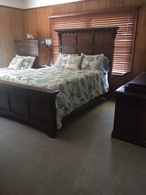 4th bedroom with a queen bed and a twin bed and large mahogany desk. All rooms have TV's