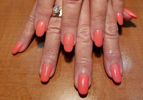 Sculpted acrylic with orange gel polish.