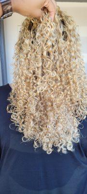 Blonde color correction on curly hair.