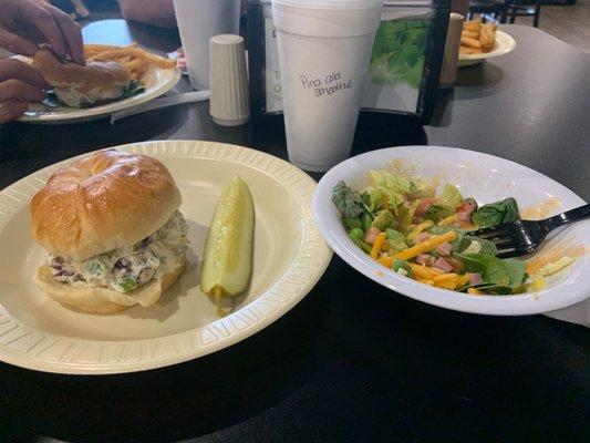 Chicken sandwich , salad, fruit smoothie.