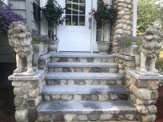 Porch entrance with stone facing and granite stair treds. Sides to match - Stunning!