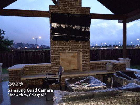 Outdoor kitchen complete with 55 inch TV and fireplace