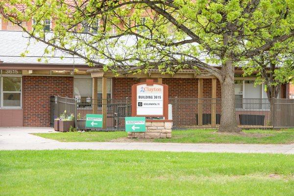 Front of DFX clinic - one-story brick building with green lawn in front