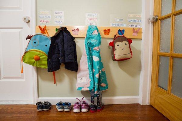 PlayGroup Gentle Separation class for nearly/early twos always begins the same way- shoes, bags, and coats by your name!