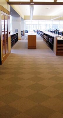 First floor has lots of tables and computers.