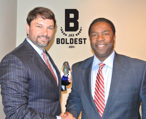 John receiving the Jax Boldest Business Award from Jacksonville's Mayor Alvin Brown