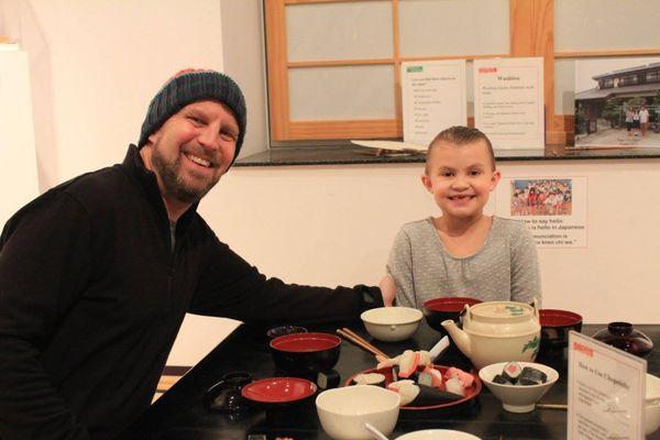 A family enjoying our Japanese Tea Room exhibit!