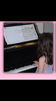 Playing her first composition on piano :)