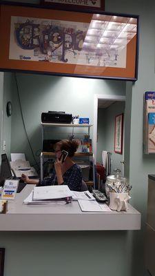 Karyn hard at work on the phone with insurance companies