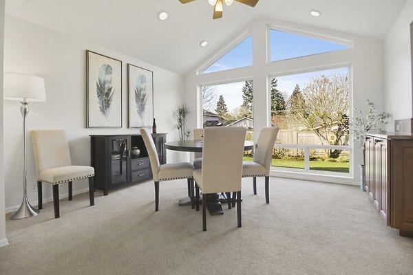 Vaulted Ceilings with a Wall of Windows in the Dining Room.