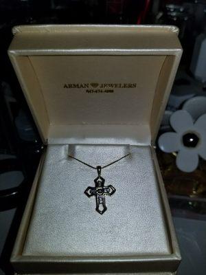 Women's gold cross with diamonds