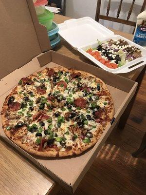 Supreme pizza and Greek salad