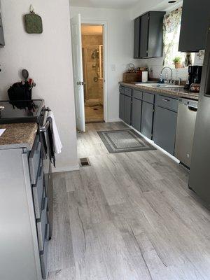 Very Happy homeowner lovers her new vinyl plank flooring.