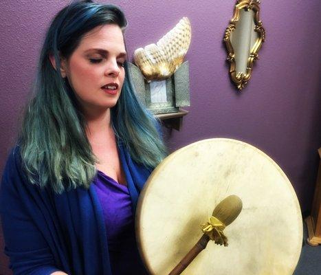 using her drum during ceremony