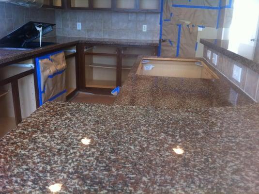 Plain, white kitchen counter tops after resurfacing.
Finish name: "Red Ash"