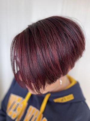 Red violet highlights cascade over a deep violet base.