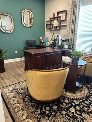 Curtains and accent wall and floating shelves and chandelier