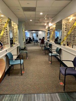 Rows of eyeglass frames on the walls.