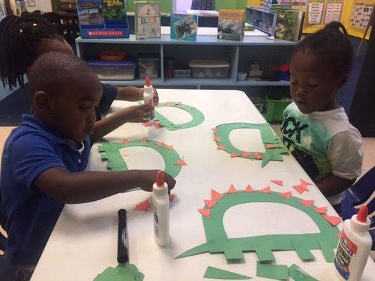 Working on letter "Dd" for dinosaur!