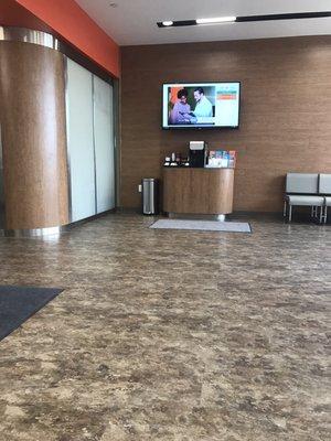 Part of the waiting area. Coffee and tea. You can see your wait time and spot in line on the tv!