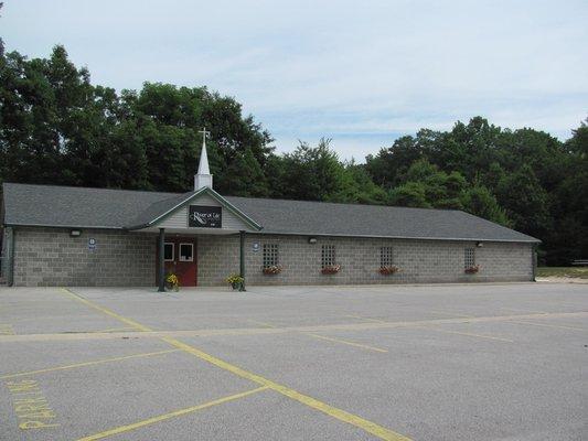 The campus includes two buildings, this is the worship center with plenty of parking. The family center is to the left closer to the road