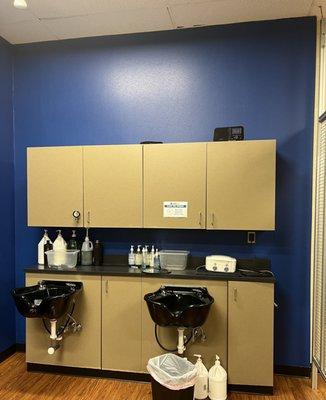 New wall paint around shampoo stations at hair salon.