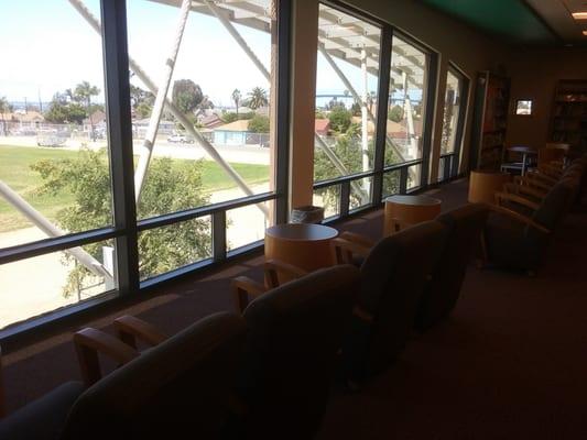 Great seating area overlooking the school field where you can settle in with a book