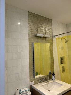 Re- grouted bathroom walls and floor