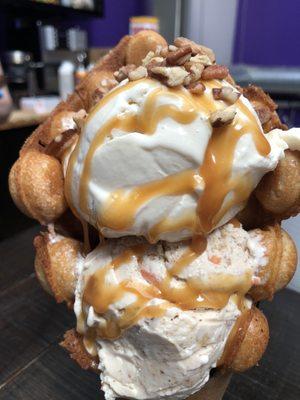 Bubble Waffle Cone with two scoops of ice cream, caramel, and pecans!