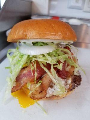 Slap in the face- burger.
5 oz burger, bacon, fried egg, tomato onion, jalapeno, lettuce. On a brioche bun