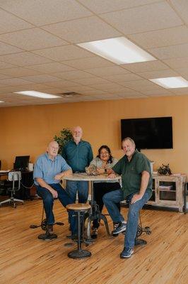 (from left to right) This is Dean Davis himself, along with his son Mike, Frida the bilingual office manager, and other son Keith!