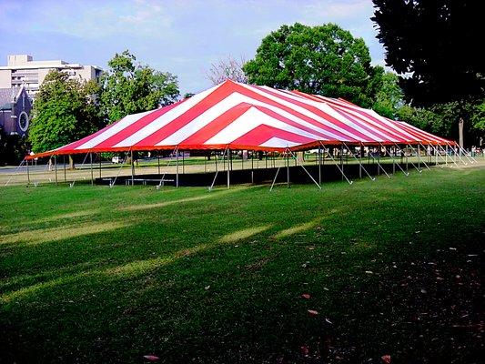 60'x120' pole tent - 7,200 sq. foot. 1,028 person capacity with chairs only, 480 person capacity with tables & chairs.