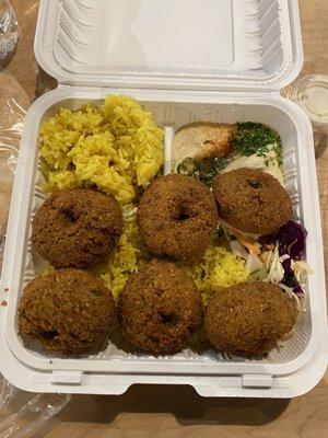 Falafel plate over rice. LOTS of rice! Had hummus as my side to go with the pita