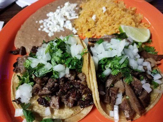 Asada taco and Lengua taco with rice and beans