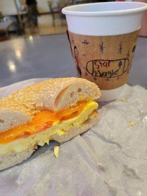 Early Bird bagel (without Swiss cheese) on a sesame bagel and a drip coffee.