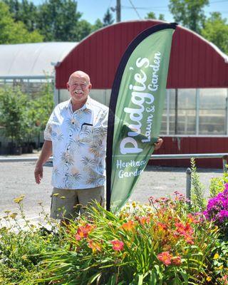 Our owner & namesake, Dan "Pudgie" Riner stands in the garden planted next to the road