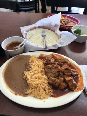 puerco costillas con frijoles and arroz! Tortillas handmade and some hot sauce! And limon