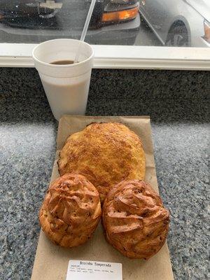 Two broinha temperada, sweet bread and coffee