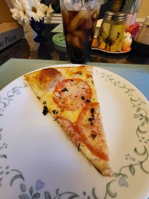 A slice of Capri pizza.