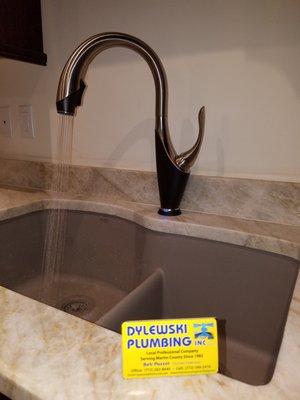 New hands free two tone kitchen sink faucet installed in Stuart, Florida