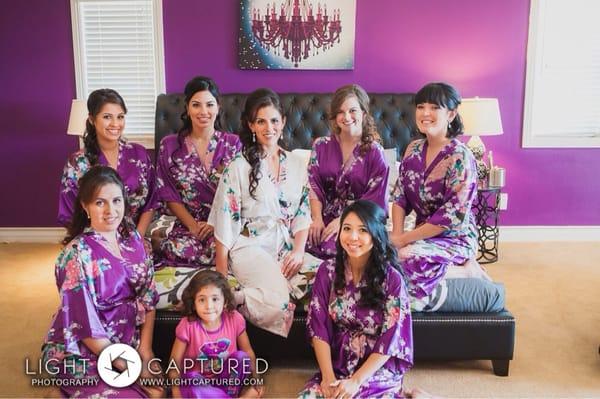 The bride, bridesmaids & flower girl, post makeup. This Shot shows the master bedroom decor in the background.