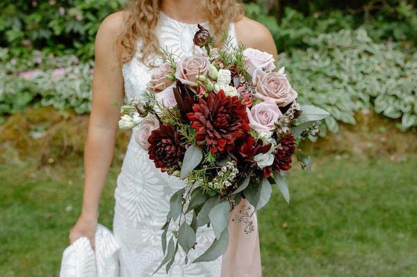 Faith roses , burgundy dahlias, eucalyptus and anemone roses for this stunning bridal bouquet