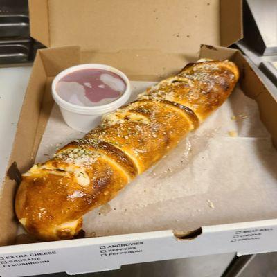 East Coast Stromboli with up to 4 toppings and mozzarella cheese dressed with garlic oil and Parmesan