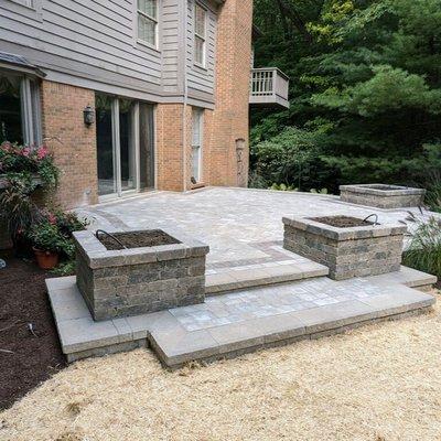 Rochester, Michigan Project showcasing our work of a brick paver patio with wallstone planting boxes