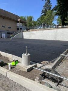 West Seattle Facility Site Work - 
Construct new retaining wall with permanent shoring, fencing, parking lot