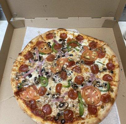 This is an outstanding pizza with ham, sausage, beef, pepperoni, mushroom, olives, green peppers, onions, tomatoes and of course cheese!