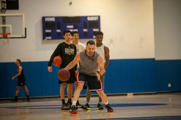 Tony Vasaturo teaching local basketball players the details of the game